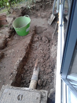 The original inspection chamber and waste pipe by the patio window.